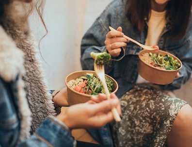 two women eating a healthy meal.